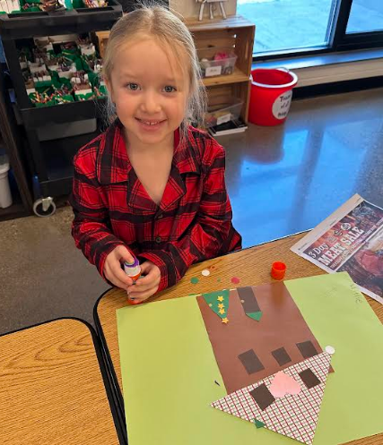 Student smiling with her project.