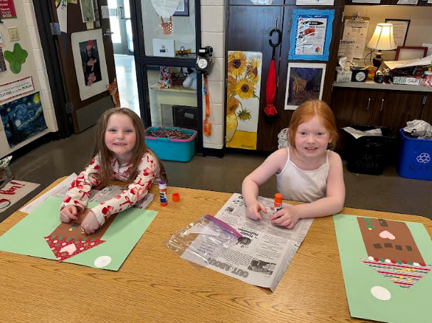 Two students smiling in the art room.