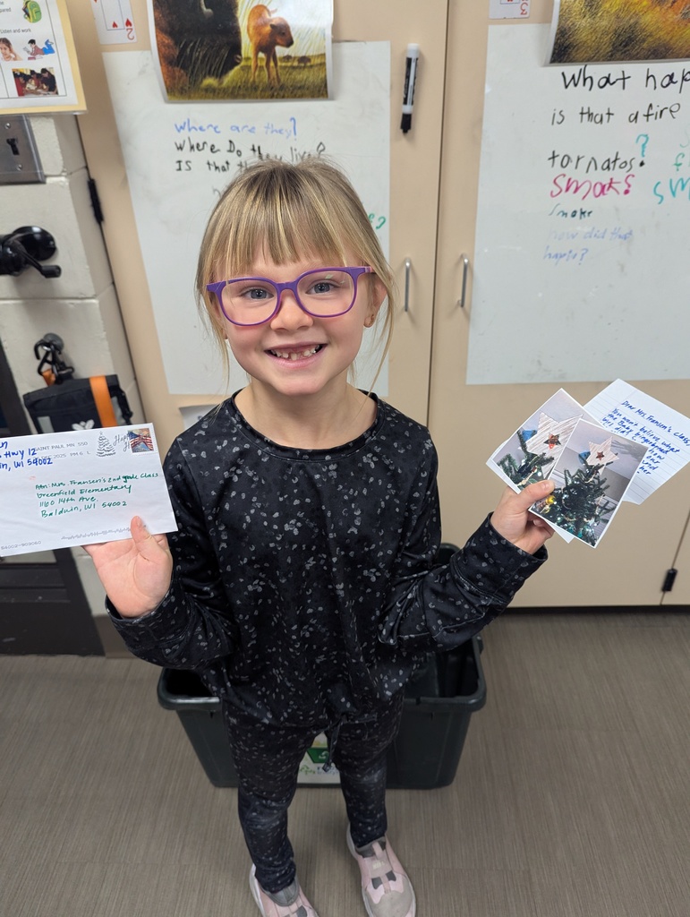 Smiling student with their mail.