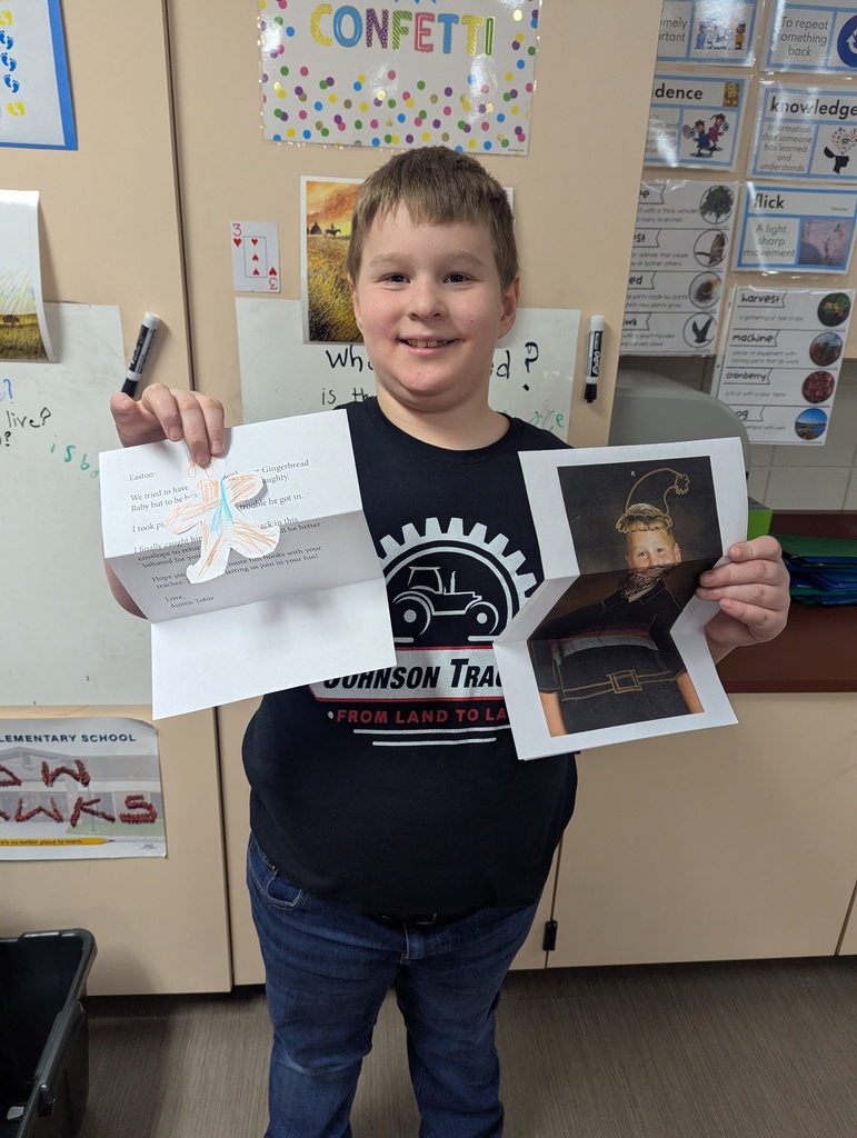 Smiling boy with his letter.
