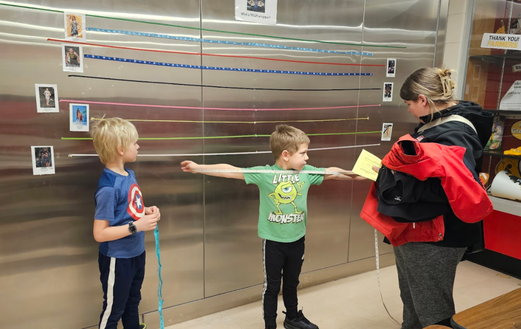 Students measuring their wingspan.