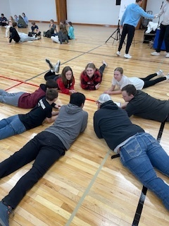 Students talking in a circle.