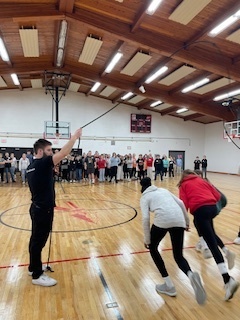 Students running through a jump rope.