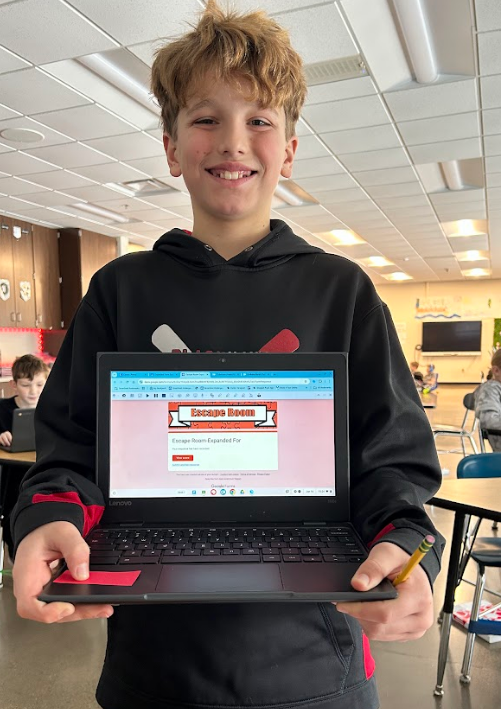 Happy student after escaping the escape room via his chromebook.