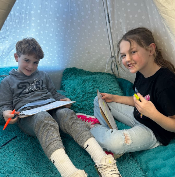 Two students smiling