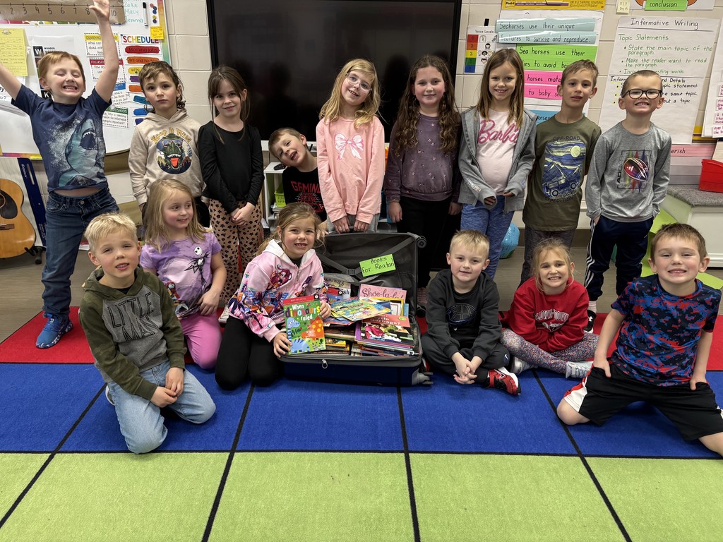 1st graders with the books they donated.