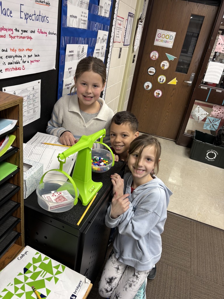 Three students smiling