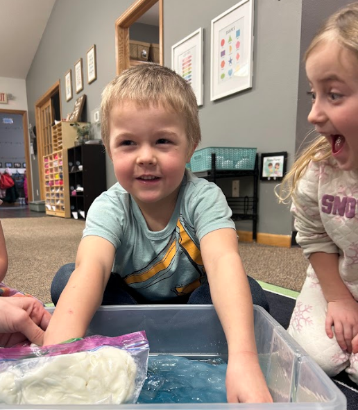 Little boy smiling and a little girl surprised. 