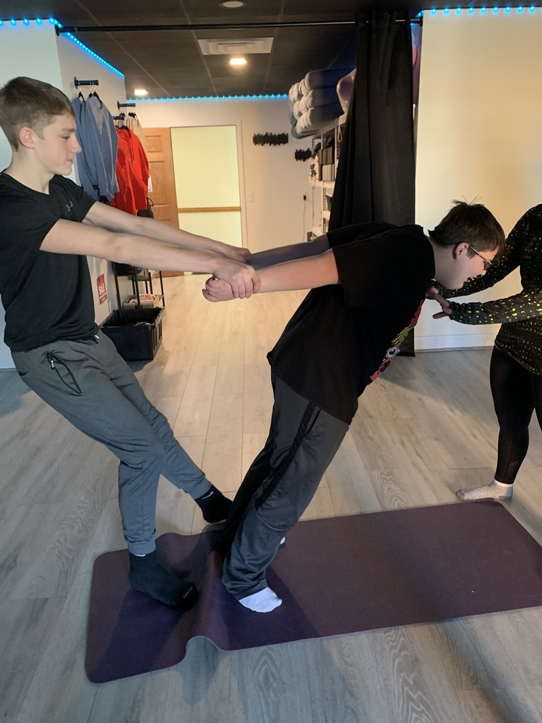 Two boys working on yoga.