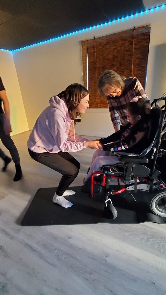 Students and instructor smiling.