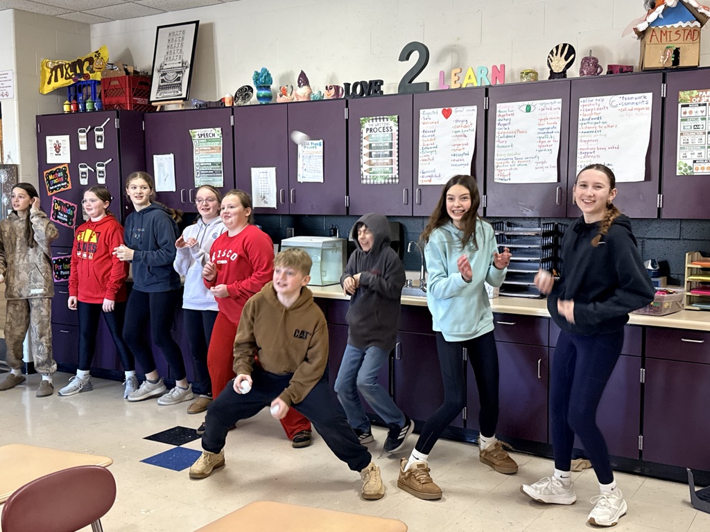 Students attempting to catch the fake snowflakes.