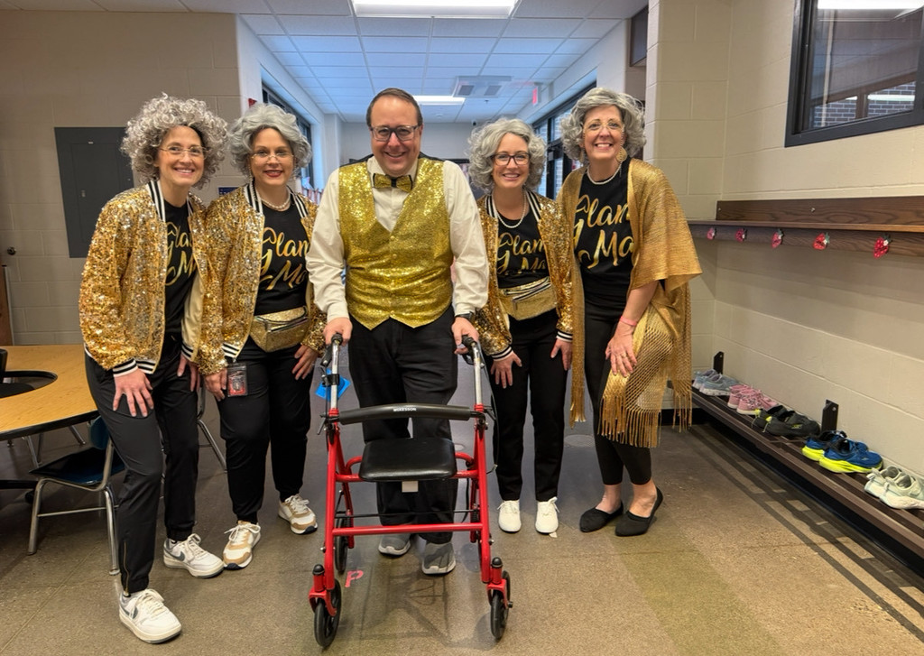 Kindergarten teachers dressed up as 100 year old grandmas and grandpas.