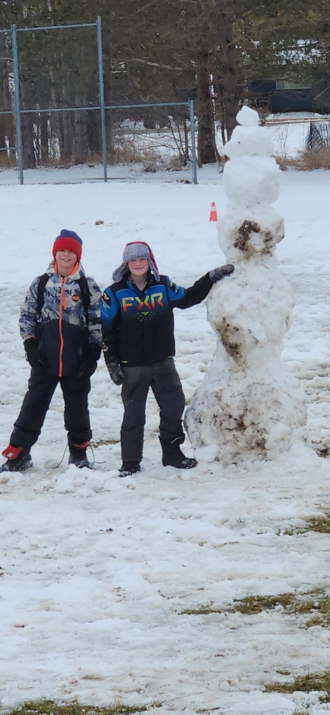 Students with a snowman.