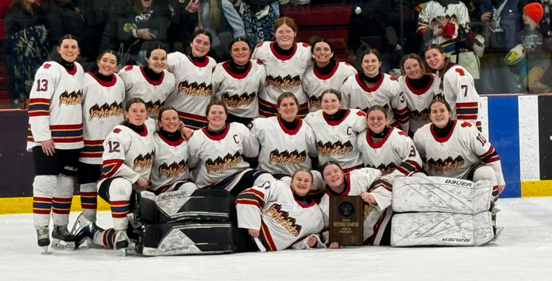 Team photo with their trophy.