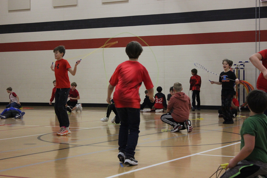 Boys jump roping in the gym.