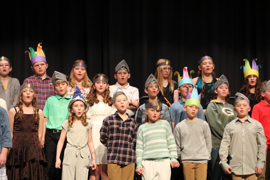 Large group photo of students singing.