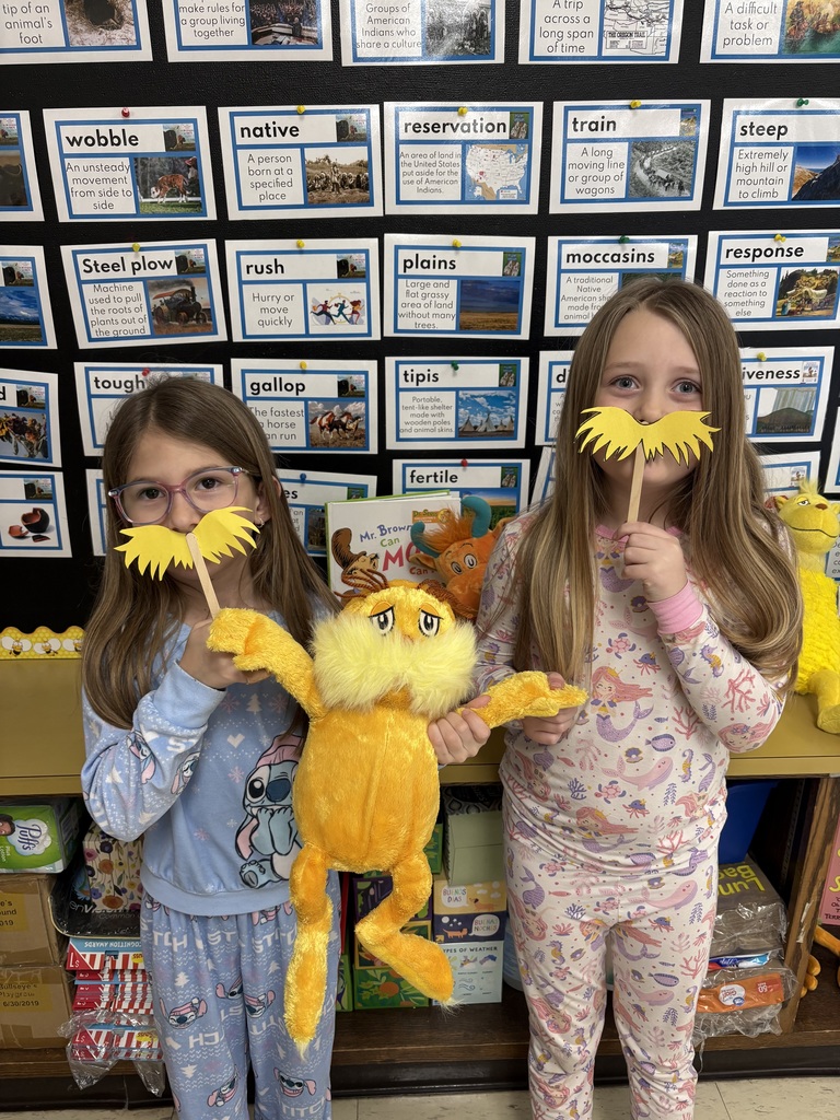 Two girls with a character.