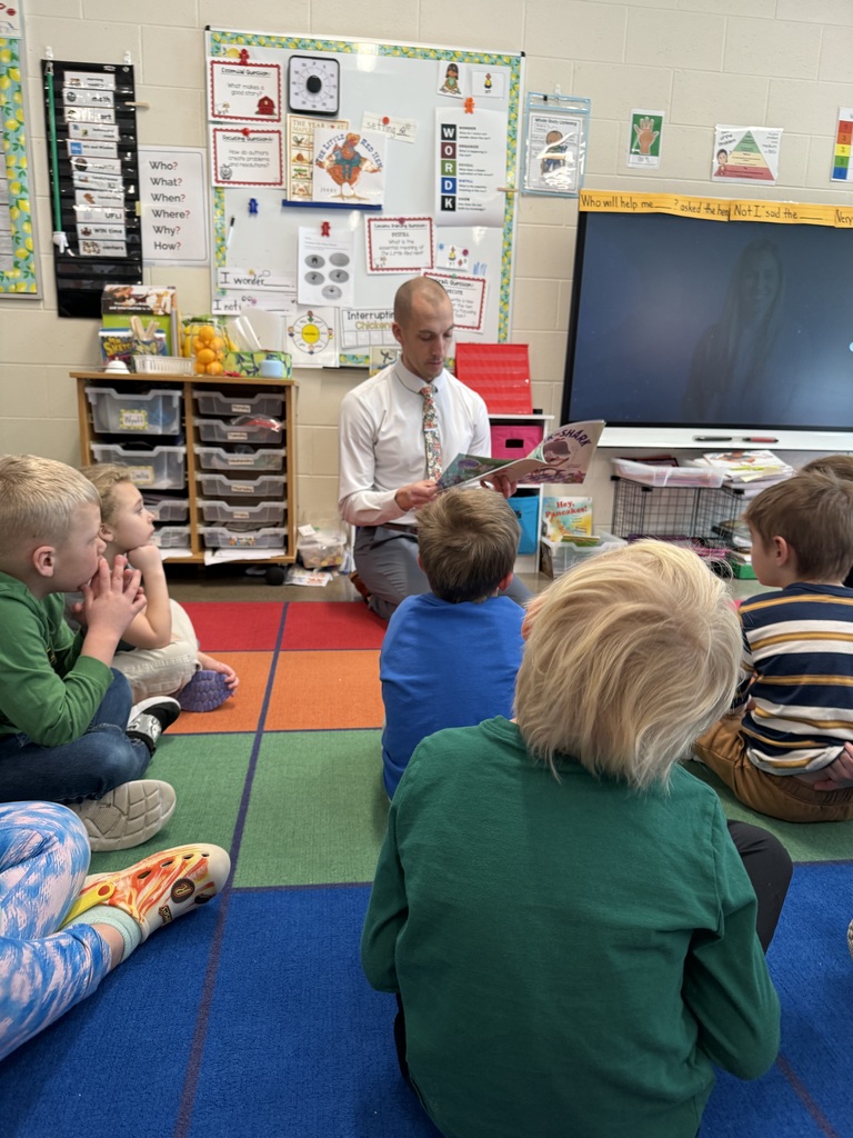 Assistant Principal Vande Berg reading.