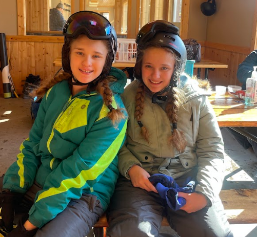 Two smiling girls ready to ski!