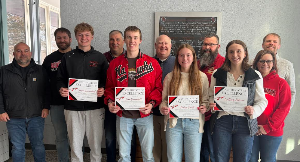 School board and students smiling.