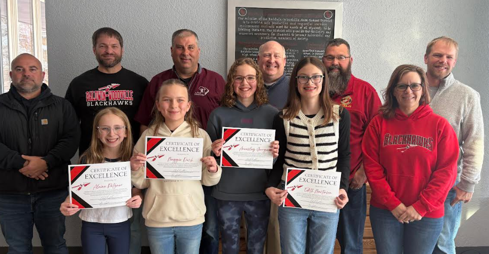 Kids Who Care representatives and the school board.