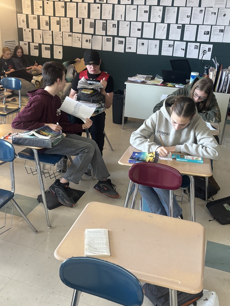 Students sitting at their desks working on a project.
