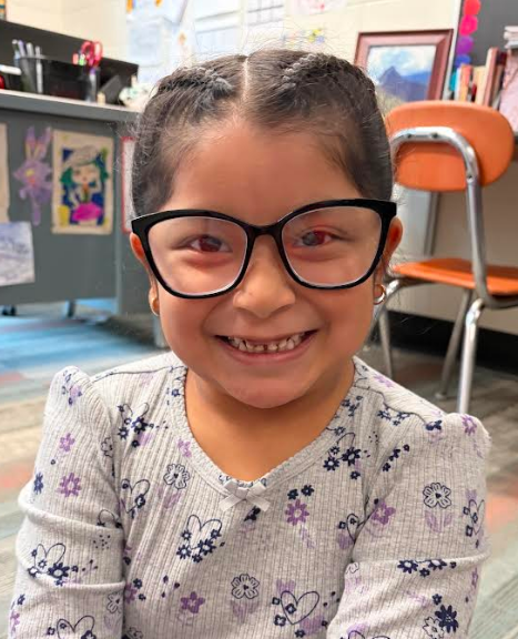 Little girl smiling in class