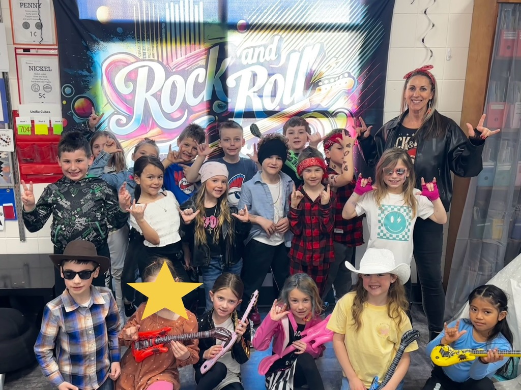 Mrs. Stimmel's  "Rock Stars of Learning" took center stage with our custom backdrop and some seriously cool inflatable guitars