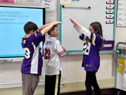 Group acting out scenes from the book.