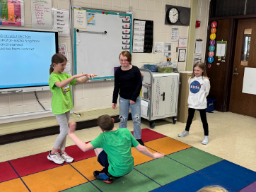 Group of four students presenting.