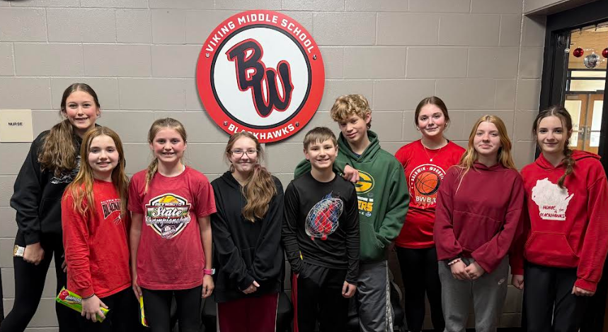 Smiling students of the month in the Viking Middle School office.