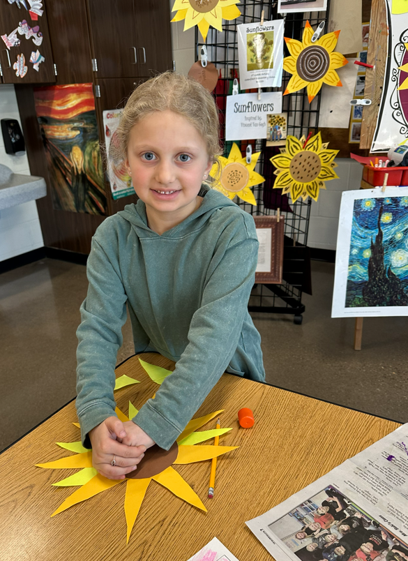 Smiling girl with her project.