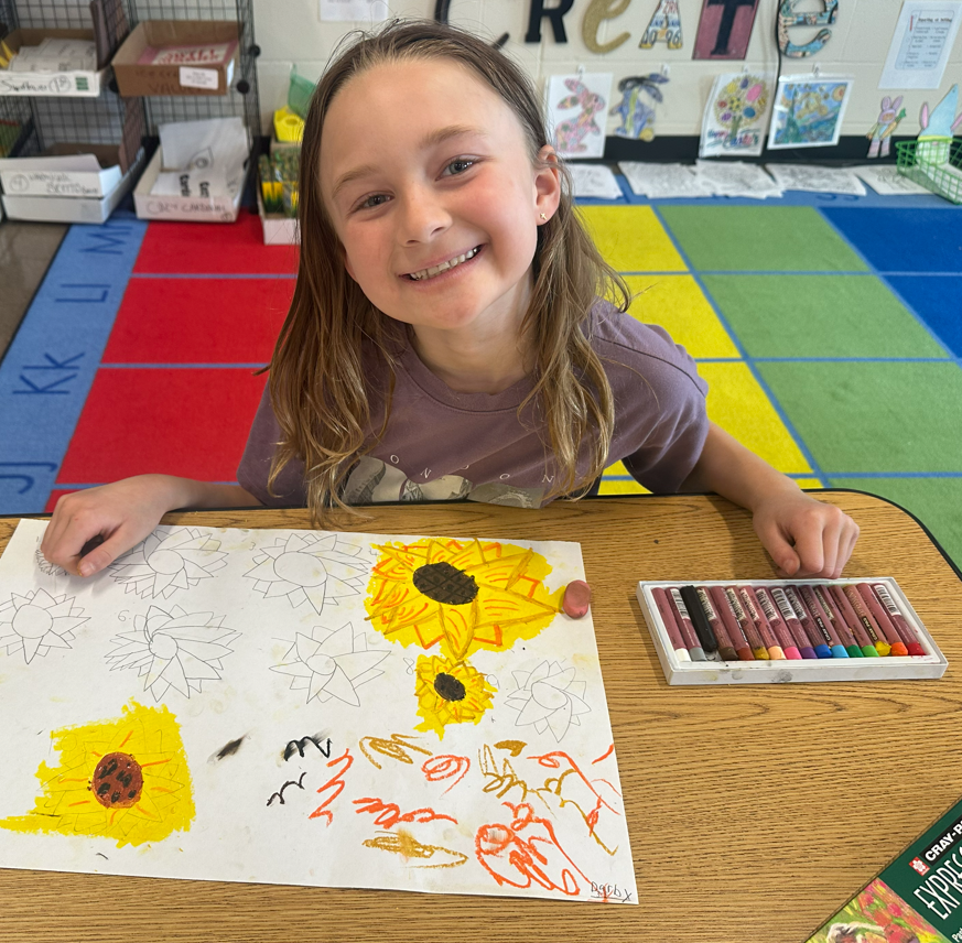 Student smiling while practicing sunflowers.