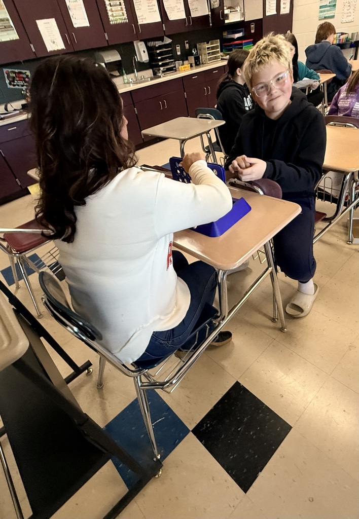 Mrs. Hawkins and student playing Connect 4