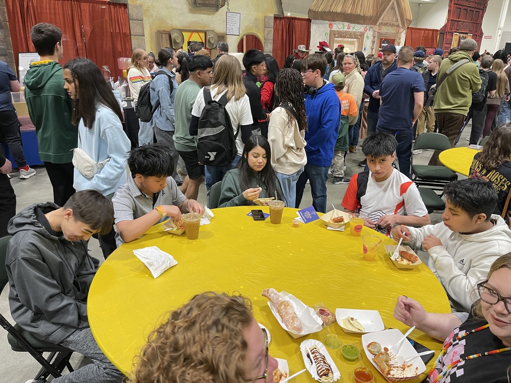 A group of students enjoying different foods.