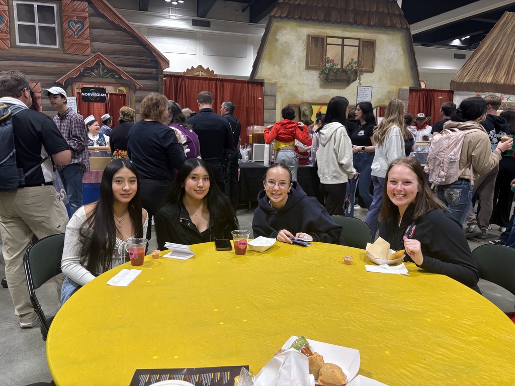 Smiling and enjoying food from around the world!