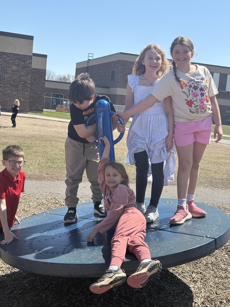 Group of students smiling and playing.