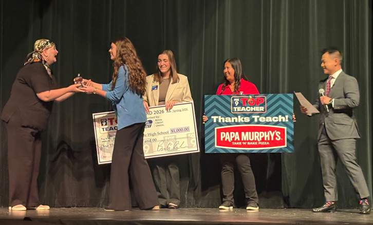 Mrs. Schmoker receiving the award.