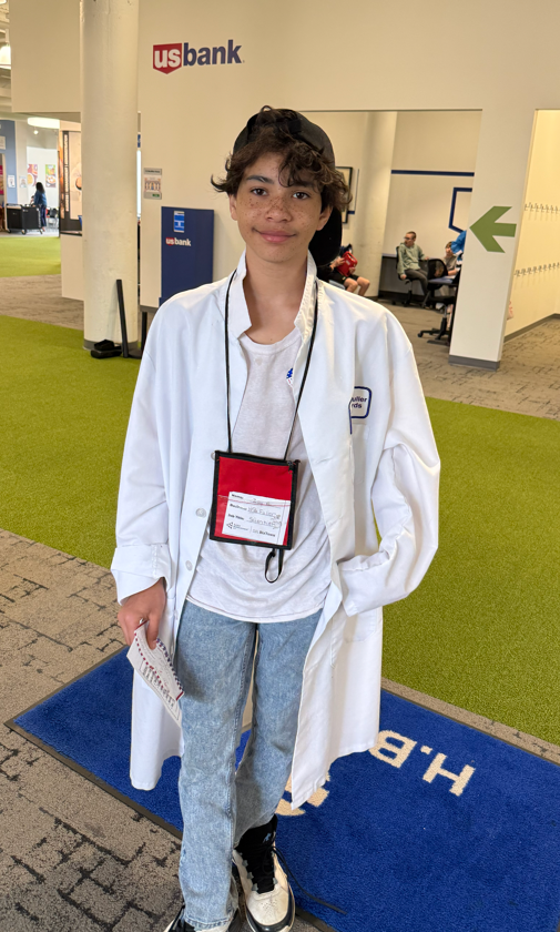 Student in a lab coat.