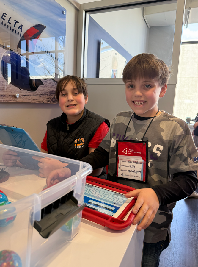 Two students "working" at BizTown.