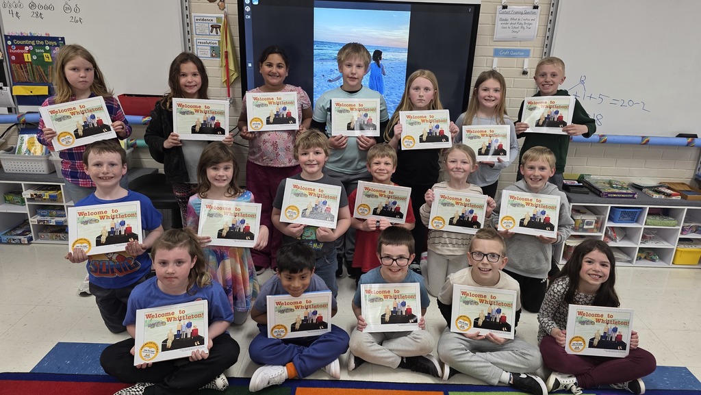 Students smiling with their books.