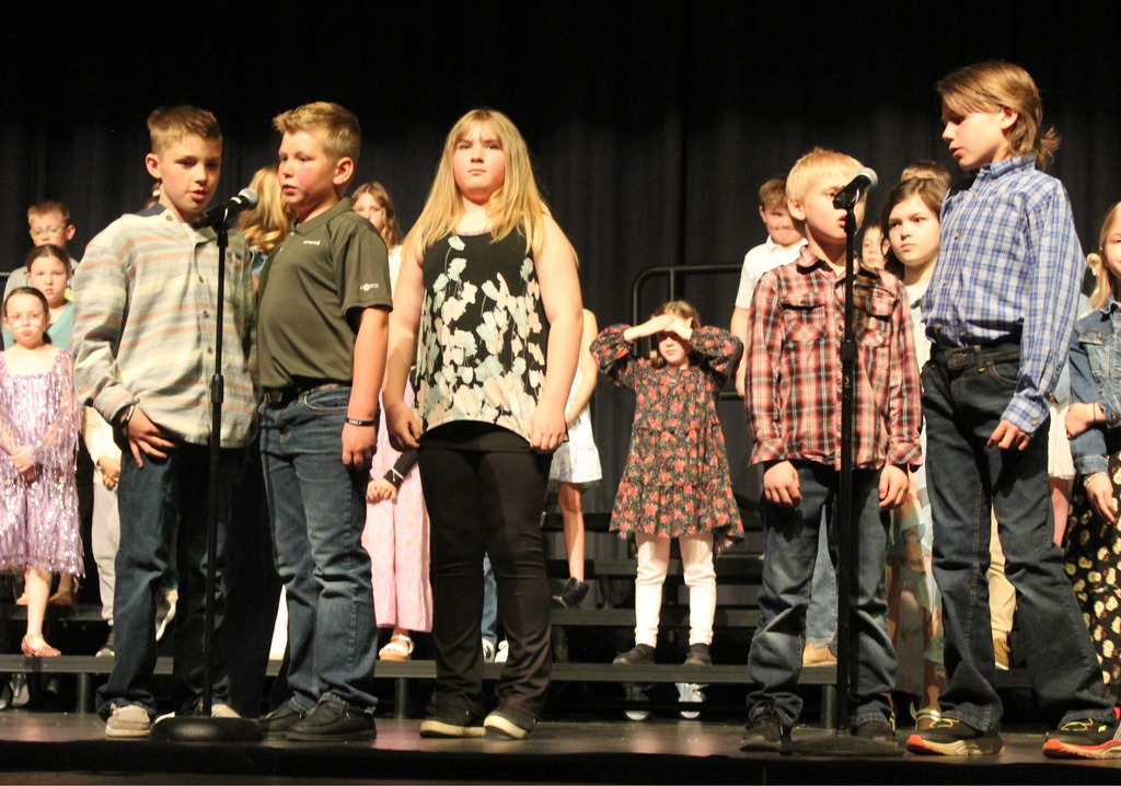 Students saying their speaking parts at the concert.