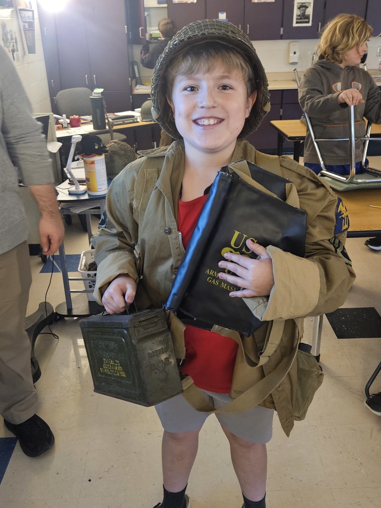 Happy student smiling in WWII reenactment gear