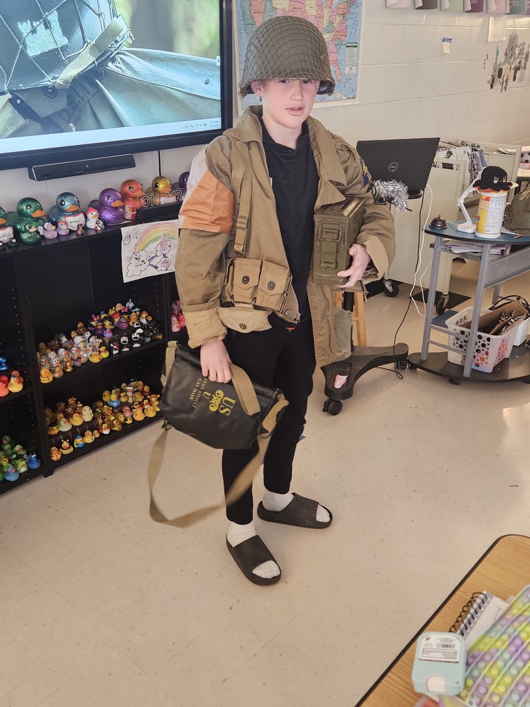 A student standing in WWII reenactment gear