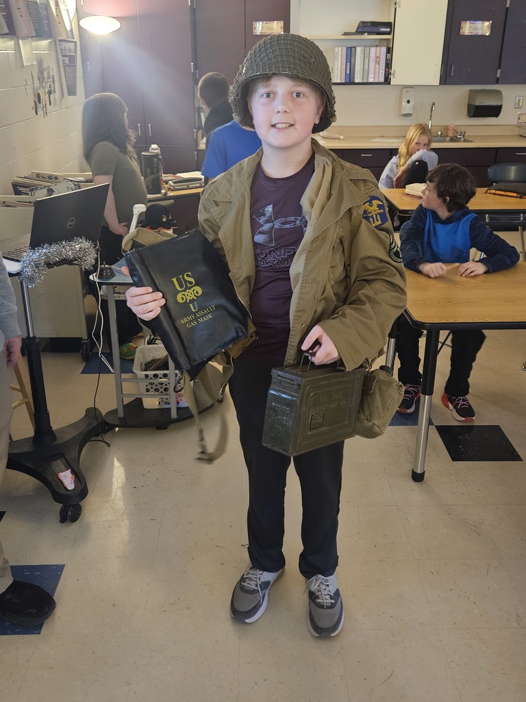 Happy student modeling the items brought in.