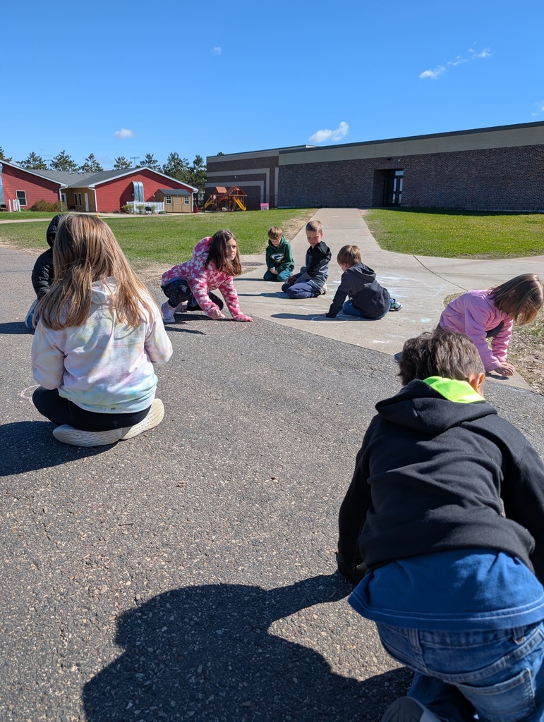 Students coloring with sidewalk chalk.