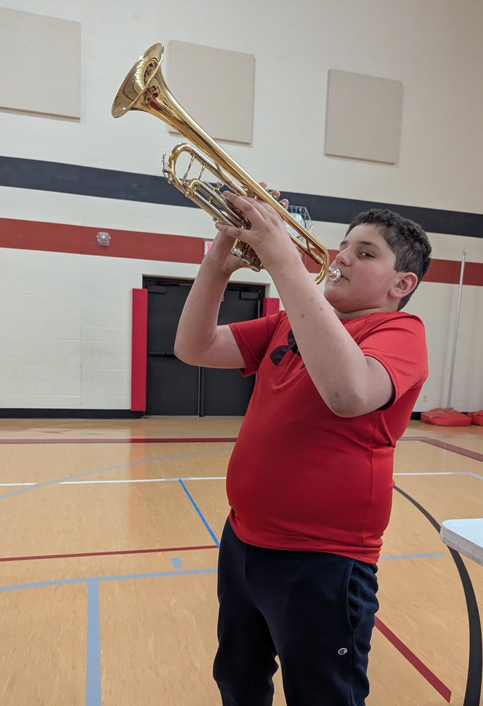 A student trying out a trumpet.