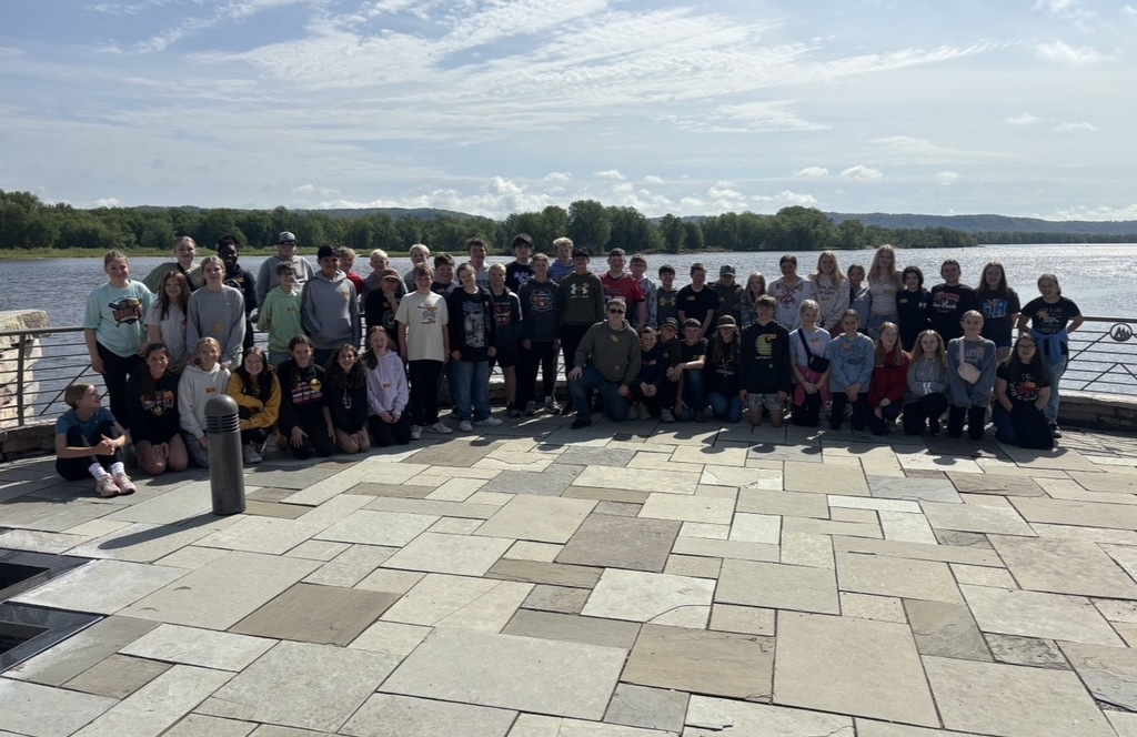 7th Grader group picture by the water.