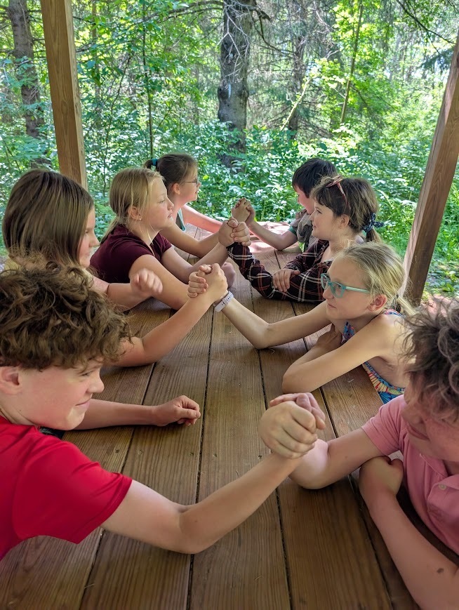 Another group of arm wrestling students.