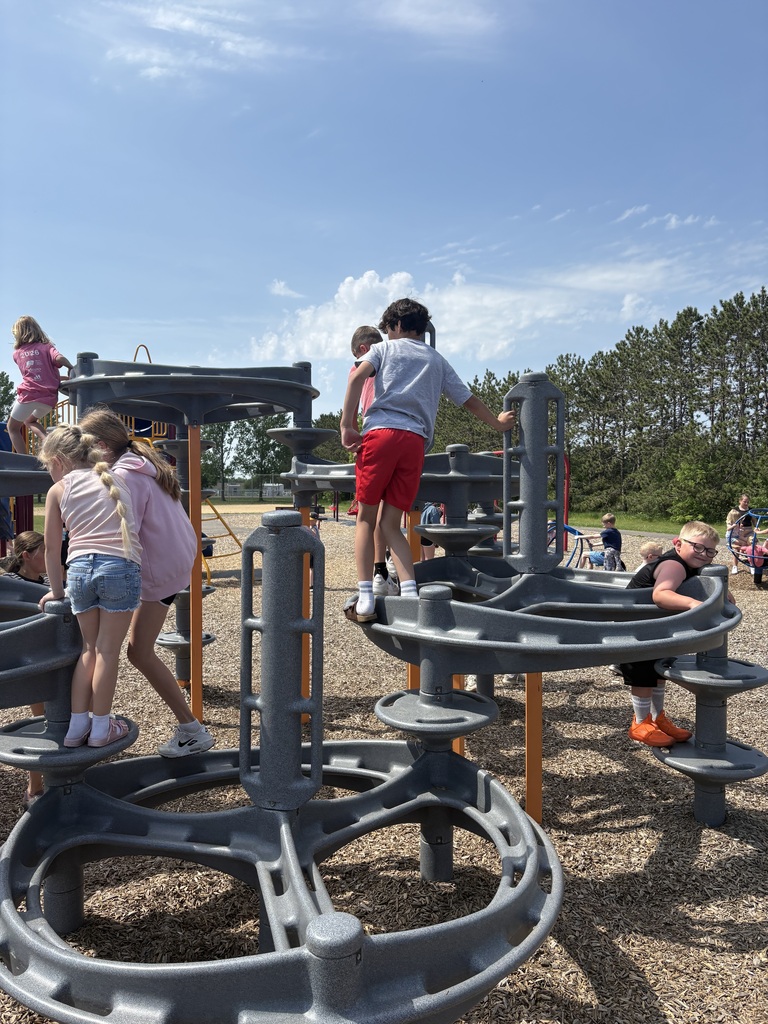 Students climbing on the playground.